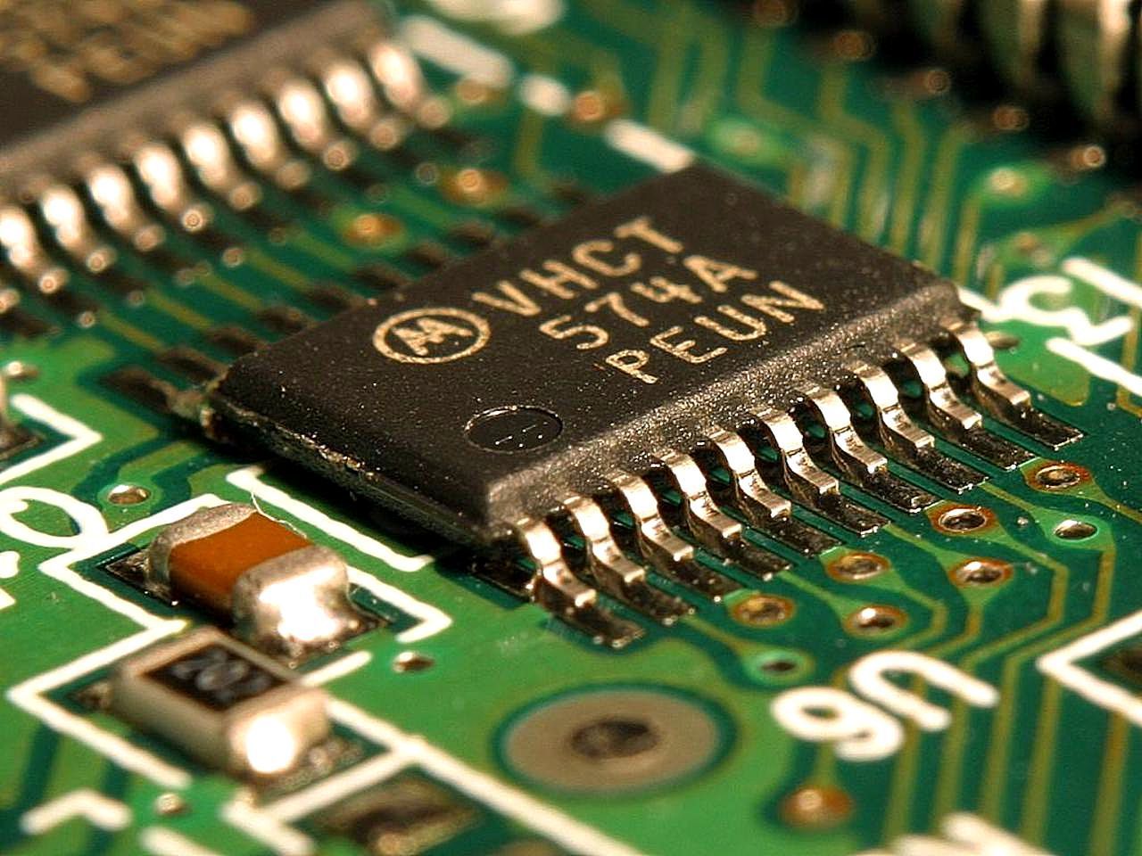 Stock image of an IC and other surface-mount components on a circuit board