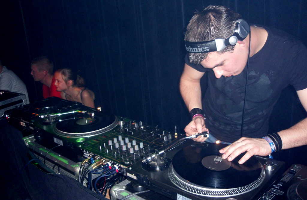 a DJ playing samples in a club