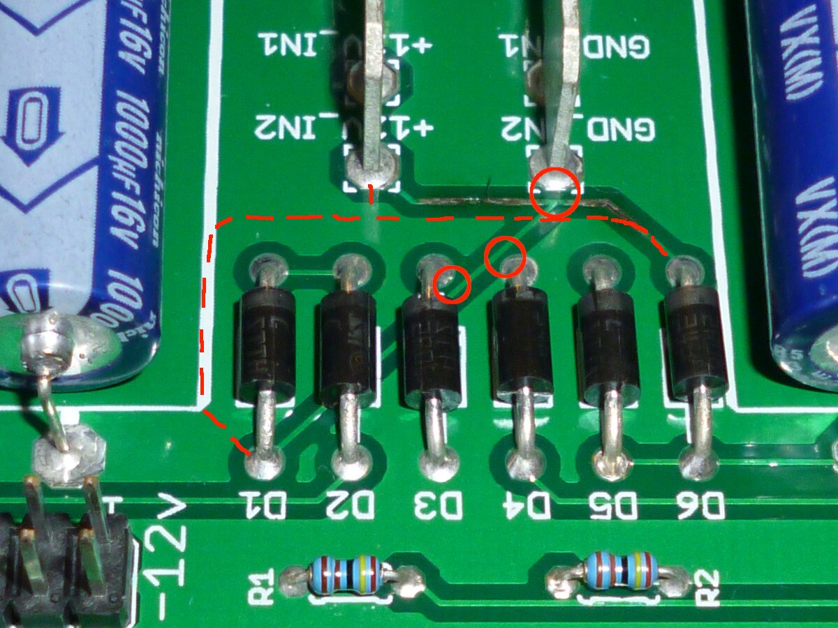 burned-up power trace with close calls and a possible rerouting marked up